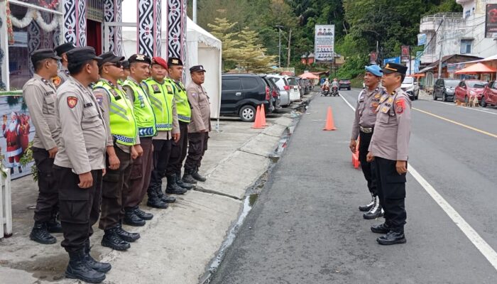 Personel Polres Simalungun Siap Siaga Amankan Arus Balik Libur Tahun Baru di Pos Yan-II Pantai Bebas Parapat: Menjaga Keamanan dan Ketertiban di Tengah Keramaian
